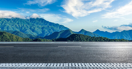 Asphalt highway road and mountain with beautiful sky clouds in the morning