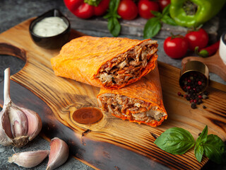 D&ouml;ner kebab in orange cheese lavash