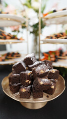 Stacked chocolate brownies served as luxurious hotel room service dessert