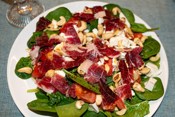 Serrano ham salad with spinach and fresh tomato