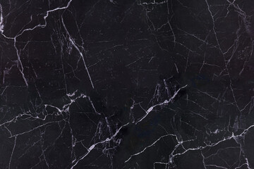 Black marble background with white veins, repeatable or tileable