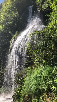 Video of Bracca Waterfall in the Forest During a Sunny Summer Day. Bergamo Province, Italian Alps