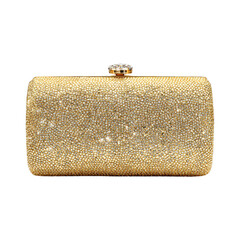 Golden clutch bag with rhinestone clasp. Isolated white background. Png format