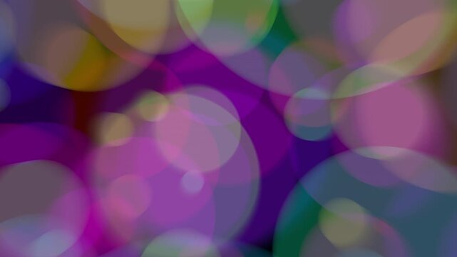 Multi-coloured Soft Blurry round bokeh bubbles floating on blackspace