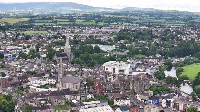 Enniscorthy drone panoramic with church and castle. Ireland small town on river.