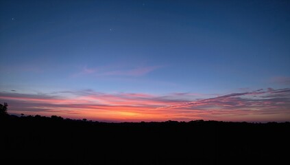 Obraz premium Beautiful twilight sky with deep blue hues, seasonal change