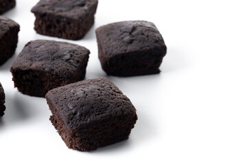 Homemade chocolate brownies isolated on white background. Copy space