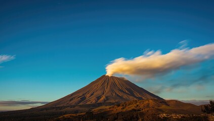 Extended exposure of an active volcano beneath a bright azure sky