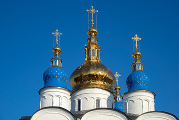 St. Sophia Cathedral domes against the blue sky. Tobolsk Kremlin, Tyumen region, Russia