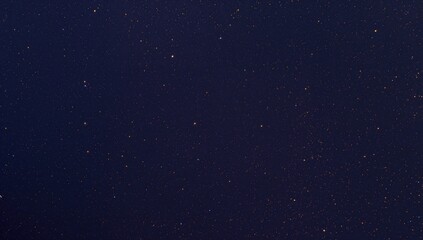 Obraz premium Countless stars spread across the nighttime sky, a reminder of celestial wonders