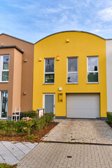 Colorful modern row houses with clean lines and bright facades in Wismar, Germany, highlighting minimalistic architecture and sustainable urban housing