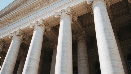 Massive white columns provide structural support and aesthetic appeal to the stone edifice