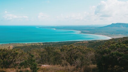 Obraz premium Sea and historic salt flats seen from a mountainous viewpoint