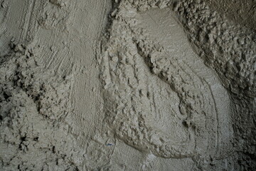 High-Resolution Texture of Freshly Poured Wet Concrete Surface Close-Up: Ideal for Backgrounds, Construction, and Architectural Design Concepts