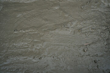 High-Resolution Texture of Freshly Poured Wet Concrete Surface Close-Up: Ideal for Backgrounds, Construction, and Architectural Design Concepts
