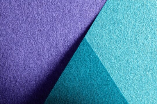Intersecting panels of textured purple and cyan material create an abstract geometric composition