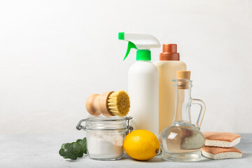 Eco cleaning.Cleaning products on a textured background. Eco-friendly home cleaning. A bottle of natural detergent surfaces, eco brushes, sponges, and rags. Cleaner concept.Cleaning supplies.Flat lay.