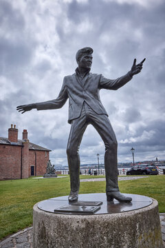 Liverpool, UK, July 6, 2025; Bronze statue of Billy Fury, created by sculptor Tom Murphy, stands proudly on Liverpool&rsquo;s waterfront.