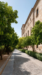 Fototapeta premium Sun-dappled cobblestone path beside rustic architecture conjures serene siestas and hidden Tuscan festa, whispering tranquil afternoon retreats
