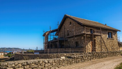 Sky over ancient architecture by the sea, showcasing construction techniques from prehistoric times