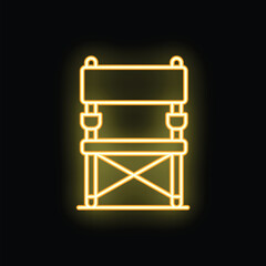 Bright yellow neon sign depicting a folding camping chair, perfect for highlighting outdoor and leisure activities