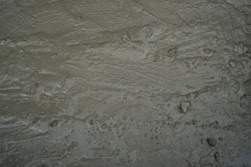 High-Resolution Texture of Freshly Poured Wet Concrete Surface Close-Up: Ideal for Backgrounds, Construction, and Architectural Design Concepts