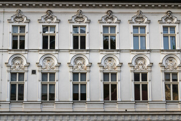 ornate neoclassical facade with decorative window frames