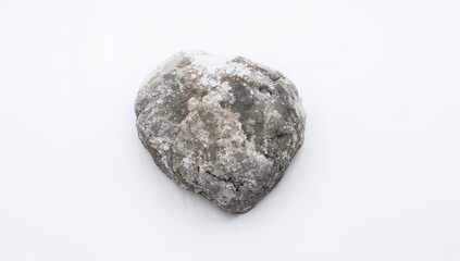 Rock covered in snow on a white backdrop