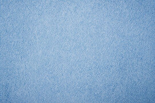 Faded denim material in a soft sky blue shade