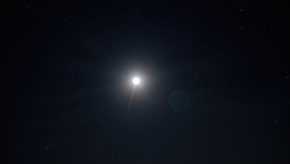 Fototapeta premium Bright full moon illuminating a clear night sky, seasonal change