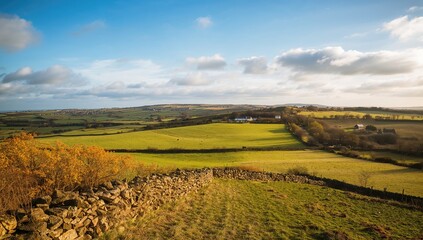 Rural landscape viewed from a hilltop, emphasizing seasonal change