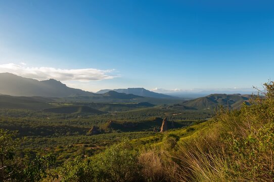 Scenic Green Hills Stretching Across a Remote Valley