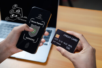 Secure online payment with credit card and smartphone app. Fintech transaction, data protection, encryption, cybersecurity, mobile banking, biometric authentication, cashless technology.