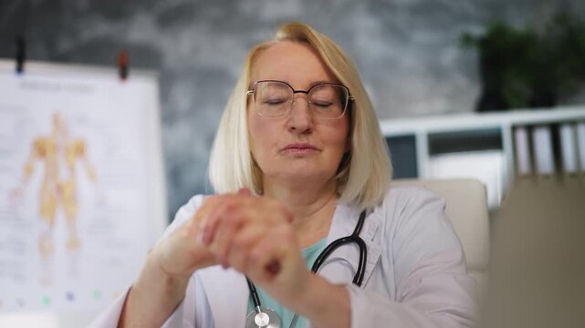 Overworked woman therapist typing on laptop, feeling sad about heavy work stress