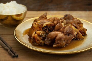 Taiwanese traditional food pork knuckle. Stewed leg pork with sweet gravy sauce style chinese food served with steamed rice. Selective focus. Shooting in studio, Clean food good taste idea concept.