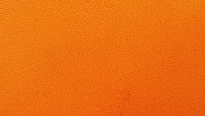 Naklejka premium Close-up of orange matte suede fabric texture, ideal as a backdrop. Premium quality image.