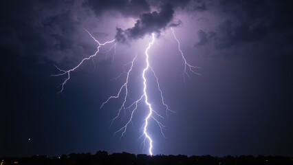 Dramatic lightning strike illuminates dark sky filled with clouds, showcasing power of nature during storm