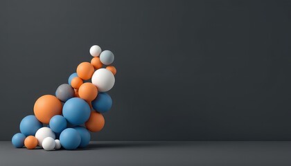 Arrangement of spheres with different sizes and colors resting on a neutral gray background surface