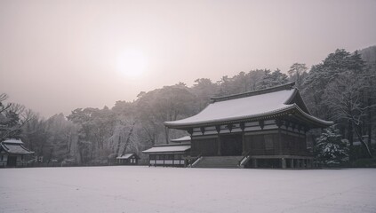 Snow-covered temple in a serene winter forest landscape