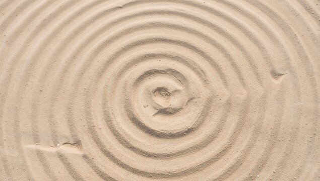Overhead shot of concentric sand circles in a tranquil Zen garden setting for mindfulness and calmness. Minimalist beige sandy texture with ample empty space.
