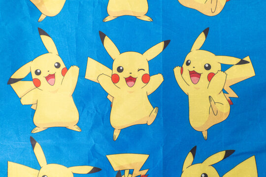 Bradford, UK Oct 30 2025 - Pikachu pok&eacute;mon print on a blue cloth from the popular Japanese animated cartoon franchise.