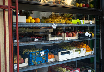 Fruit displayed in a fruit shop window display. Fruit shop. Fruit shop window display.