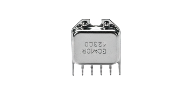 Close-up of a vintage electronic component a small silver-colored integrated circuit with visible pins isolated on a white background showcasing its intricate design and historical significance in.