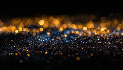 Blurred golden, blue, and black shimmering lights as a background