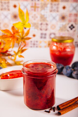 Homemade plum jam and fresh organic plums
