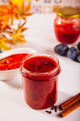 Homemade plum jam and fresh organic plums