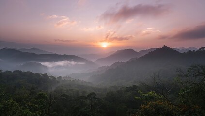 Obraz premium Misty sunrise illuminating mountain peaks, showcasing seasonal change