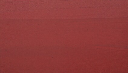 Fototapeta premium Textured wooden surface with a smooth, reddish-brown finish and slight color variations