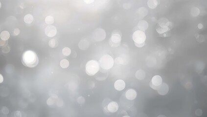 Blurred abstract backdrop with white bokeh lights, evoking a winter or snow theme