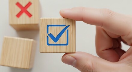 Hand holding a wooden block with a blue checkmark symbol signifying approval